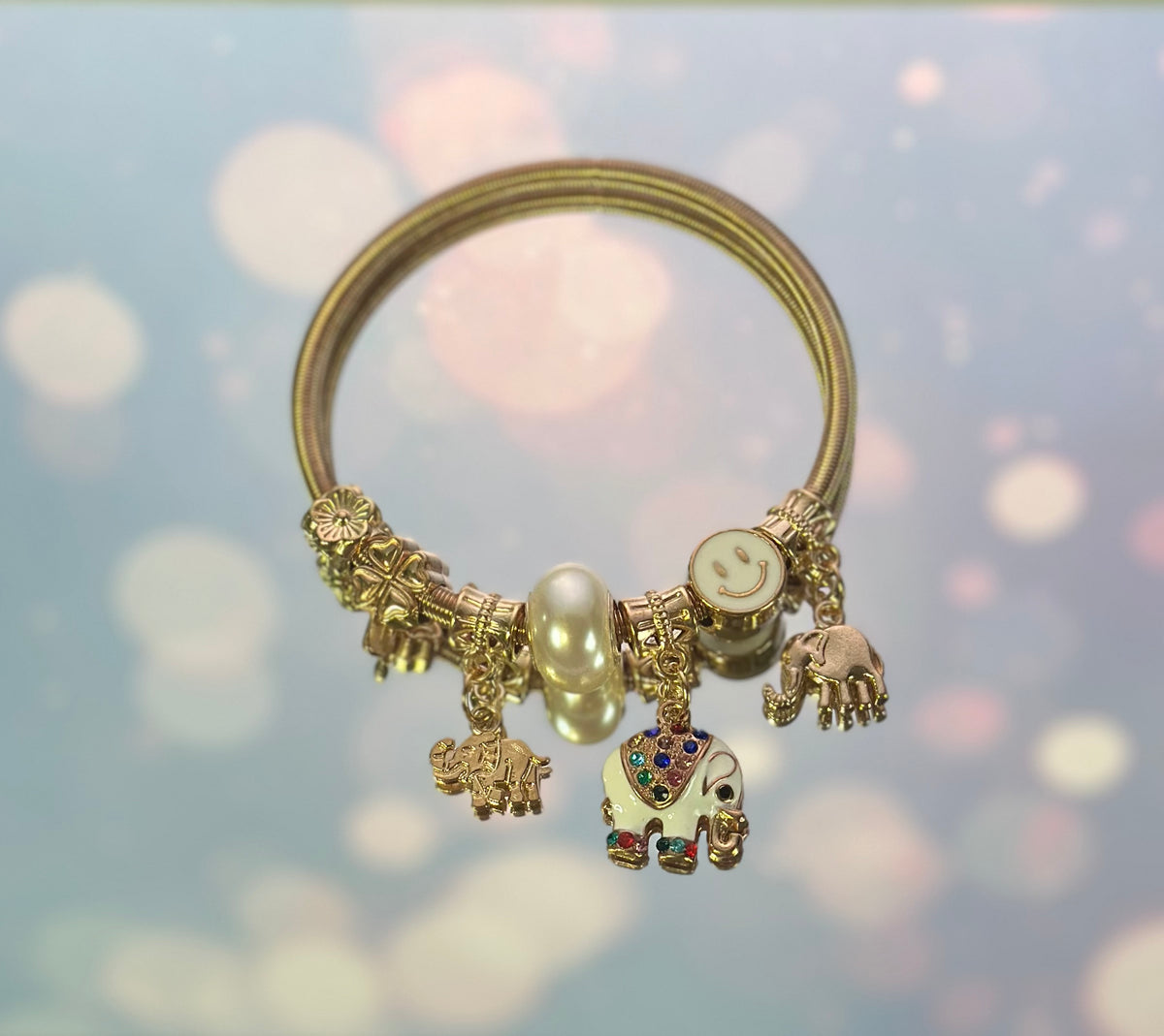 B-Gold plated elastic White Elephant bracelet with charms