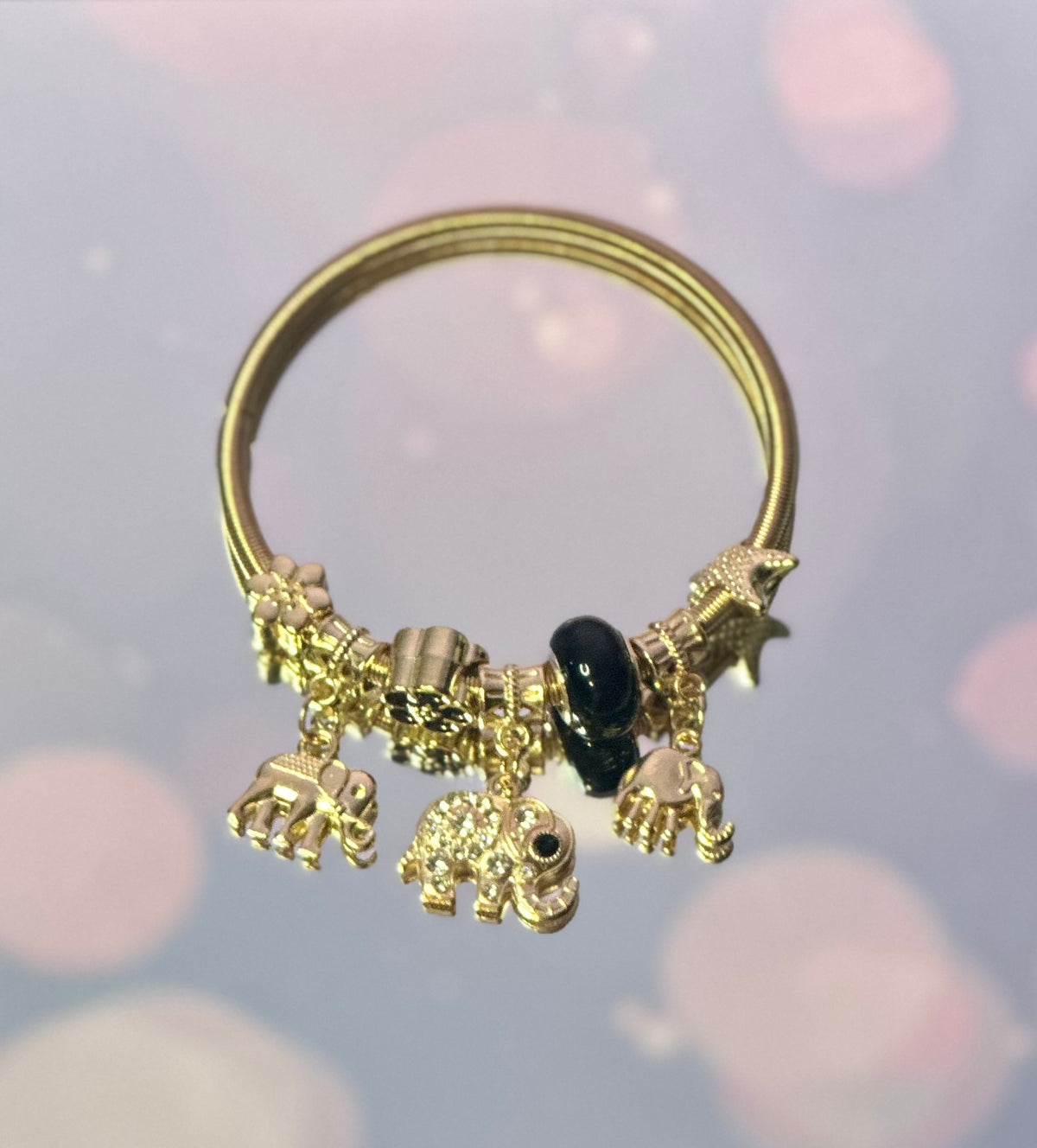 A-Gold plated elastic bracelet with black beads charms