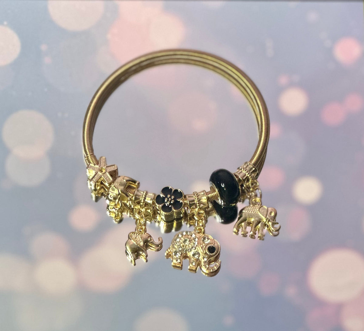 B-Gold plated elastic bracelet with black beads charms